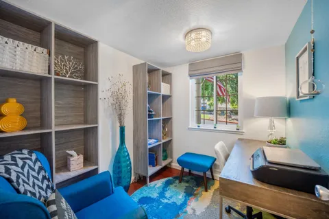 a living room with furniture and a window