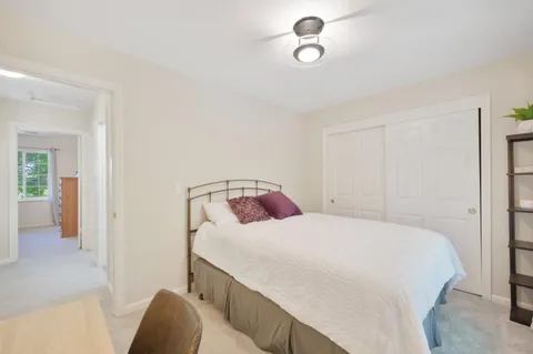 a bedroom with a bed and cabinets