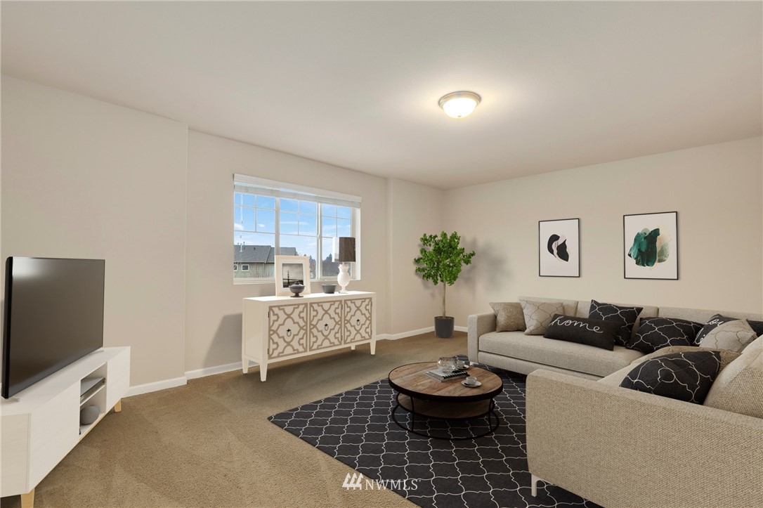 7301 Radius Loop Southeast Lacey, WA 98513 - Photo 16 of 39 a living room with furniture and a flat screen tv
