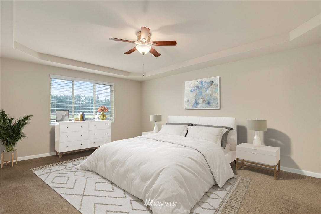 7301 Radius Loop Southeast Lacey, WA 98513 - Photo 19 of 39 a bedroom with a large bed and a window