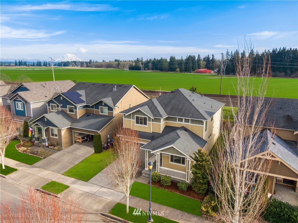 7301 Radius Loop Southeast Lacey, WA 98513 - Photo 2 of 39 an aerial view of a house with outdoor space lake view