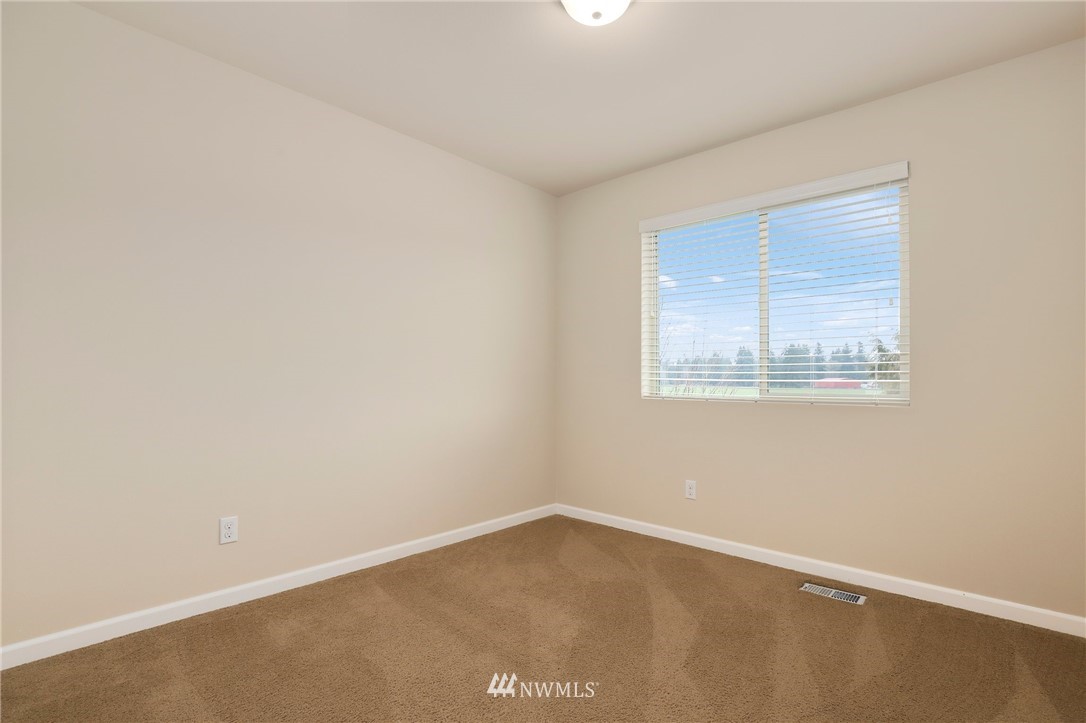 7301 Radius Loop Southeast Lacey, WA 98513 - Photo 23 of 39 an empty room with a window