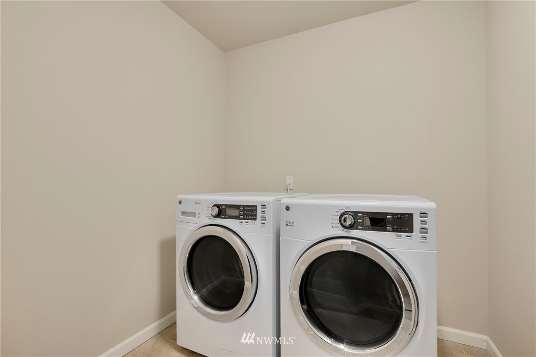 7301 Radius Loop Southeast Lacey, WA 98513 - Photo 26 of 39 a utility room with dryer and washer