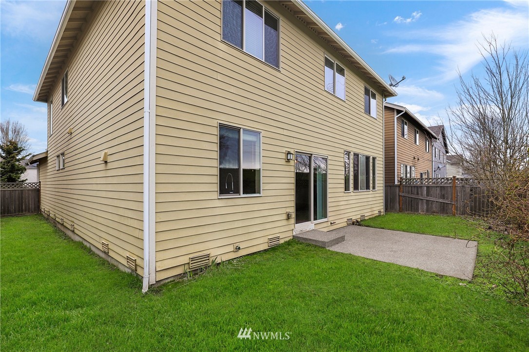 7301 Radius Loop Southeast Lacey, WA 98513 - Photo 30 of 39 a view of a white house with a yard