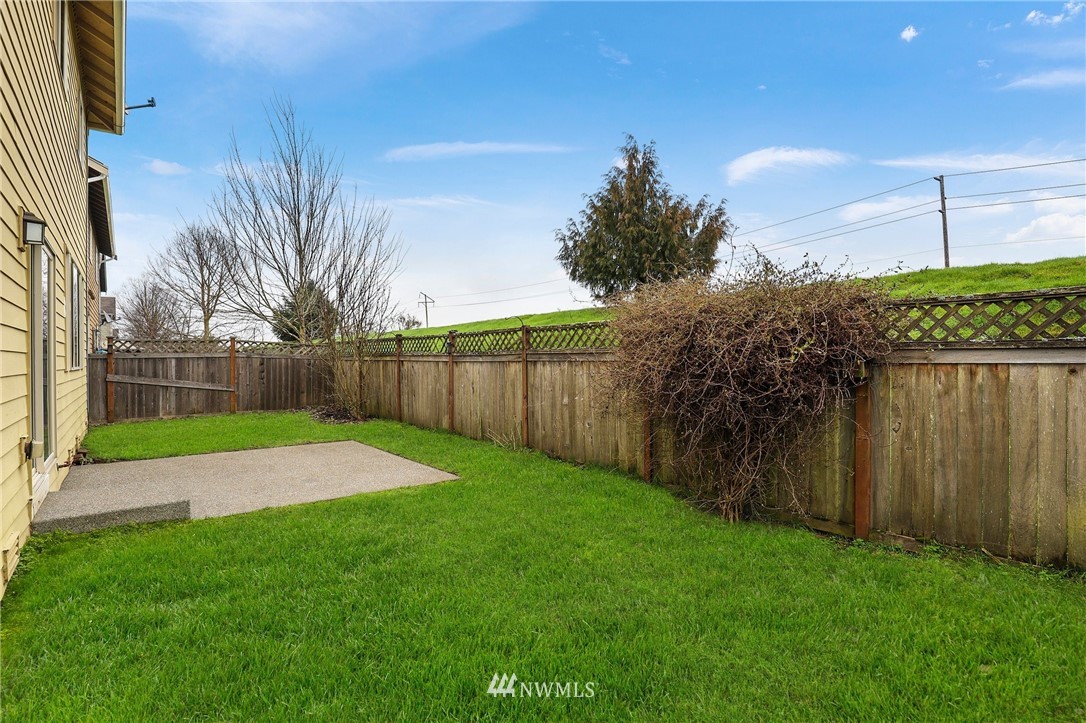 7301 Radius Loop Southeast Lacey, WA 98513 - Photo 32 of 39 a view of a backyard with green space