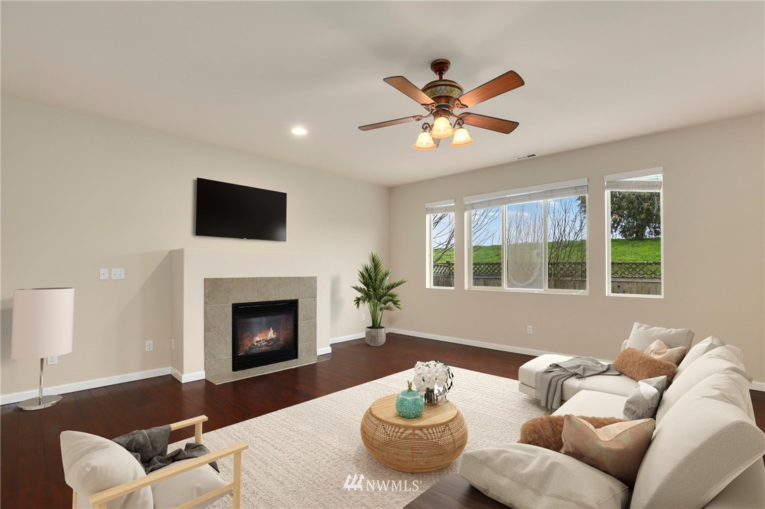 7301 Radius Loop Southeast Lacey, WA 98513 - Photo 9 of 39 a living room with furniture and a fireplace
