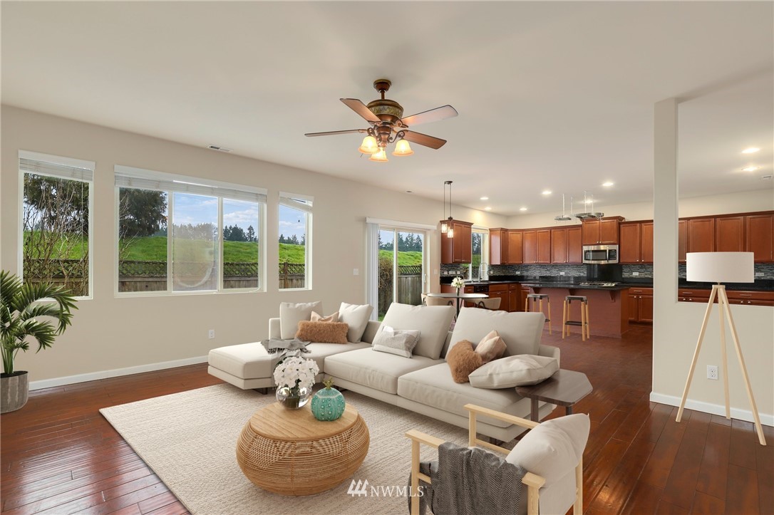 7301 Radius Loop Southeast Lacey, WA 98513 - Photo 10 of 39 a living room with furniture and a large window