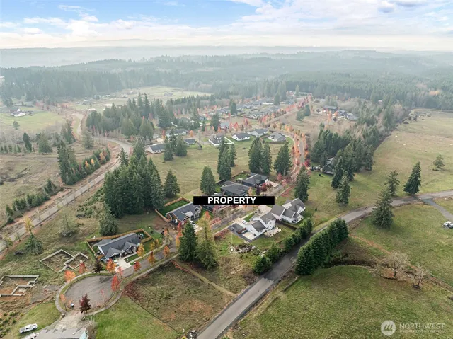 an aerial view of a houses with outdoor space