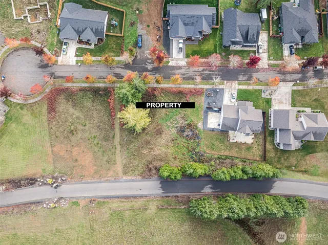 an aerial view of a house with a lake view