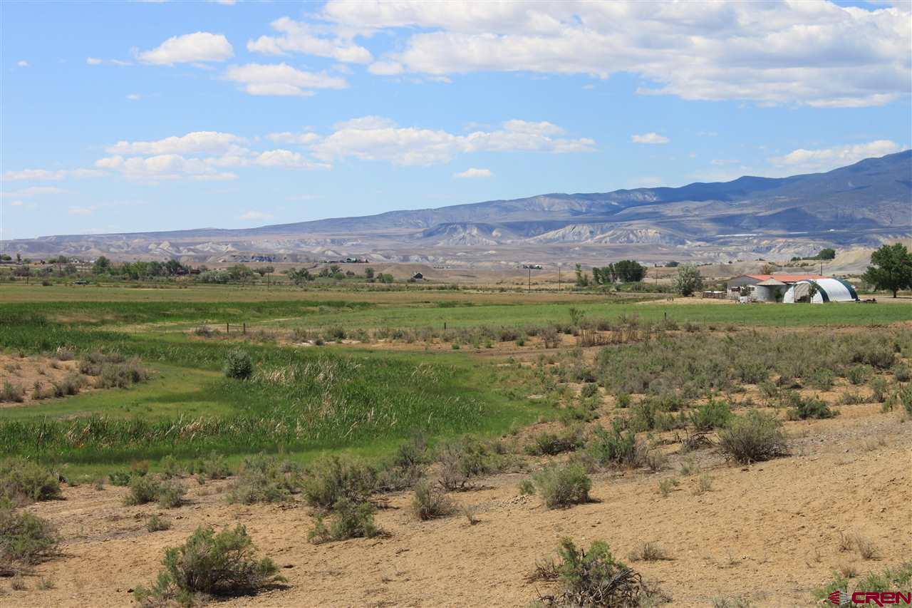 13580 25 Mesa Road Delta, CO 81416 - Photo 17 of 33 a view of a town with mountains in the background