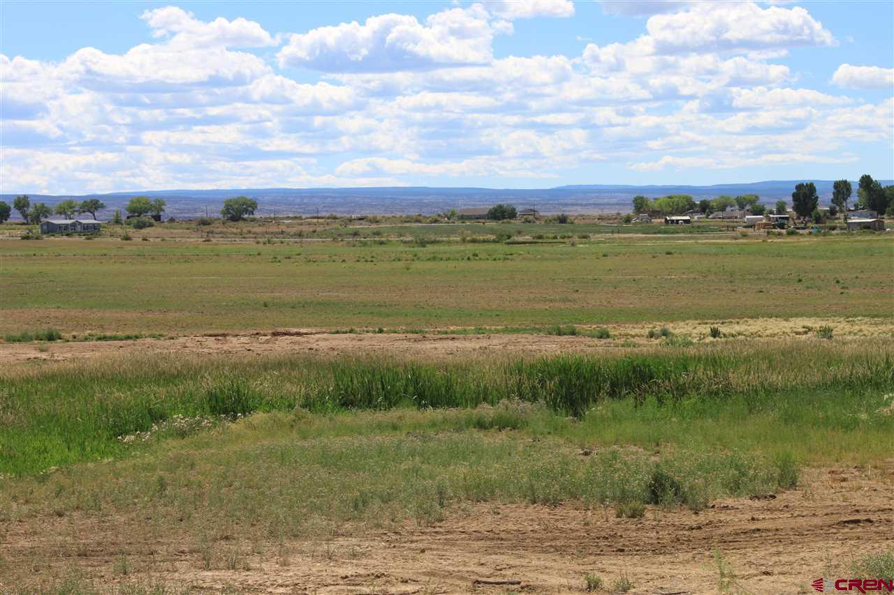 13580 25 Mesa Road Delta, CO 81416 - Photo 22 of 33 a view of a lake with houses