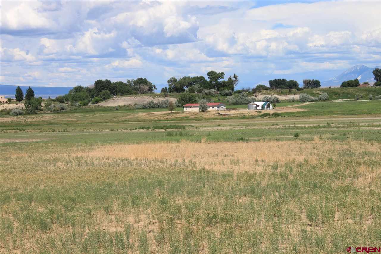 13580 25 Mesa Road Delta, CO 81416 - Photo 26 of 33 a view of lake with mountain in the back