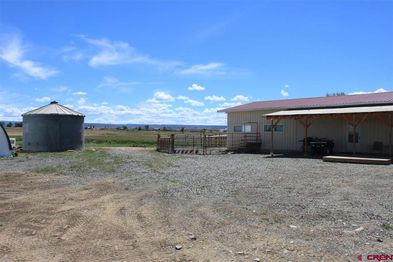 13580 25 Mesa Road Delta, CO 81416 - Photo 5 of 33 a view of a barn with a yard