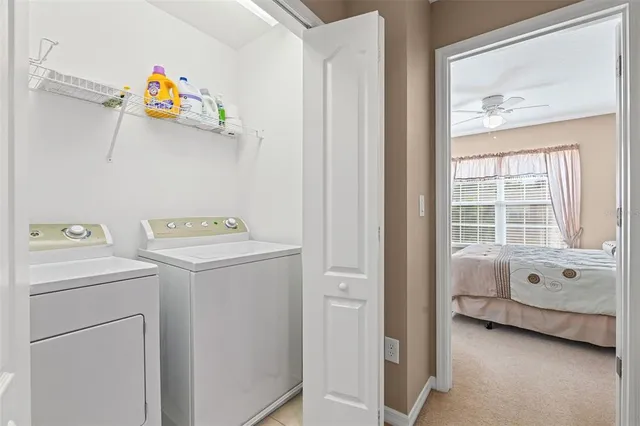 a view of a hallway with entryway wooden floor and front door