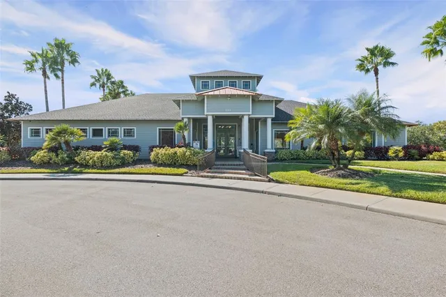 a view of swimming pool with outdoor seating and plants