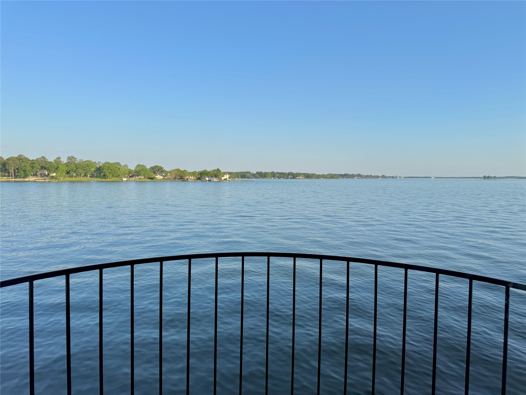 7041 Kingston Cove Lane, Unit 241 Willis, TX 77318 - Photo 1 of 17 a balcony with an ocean view