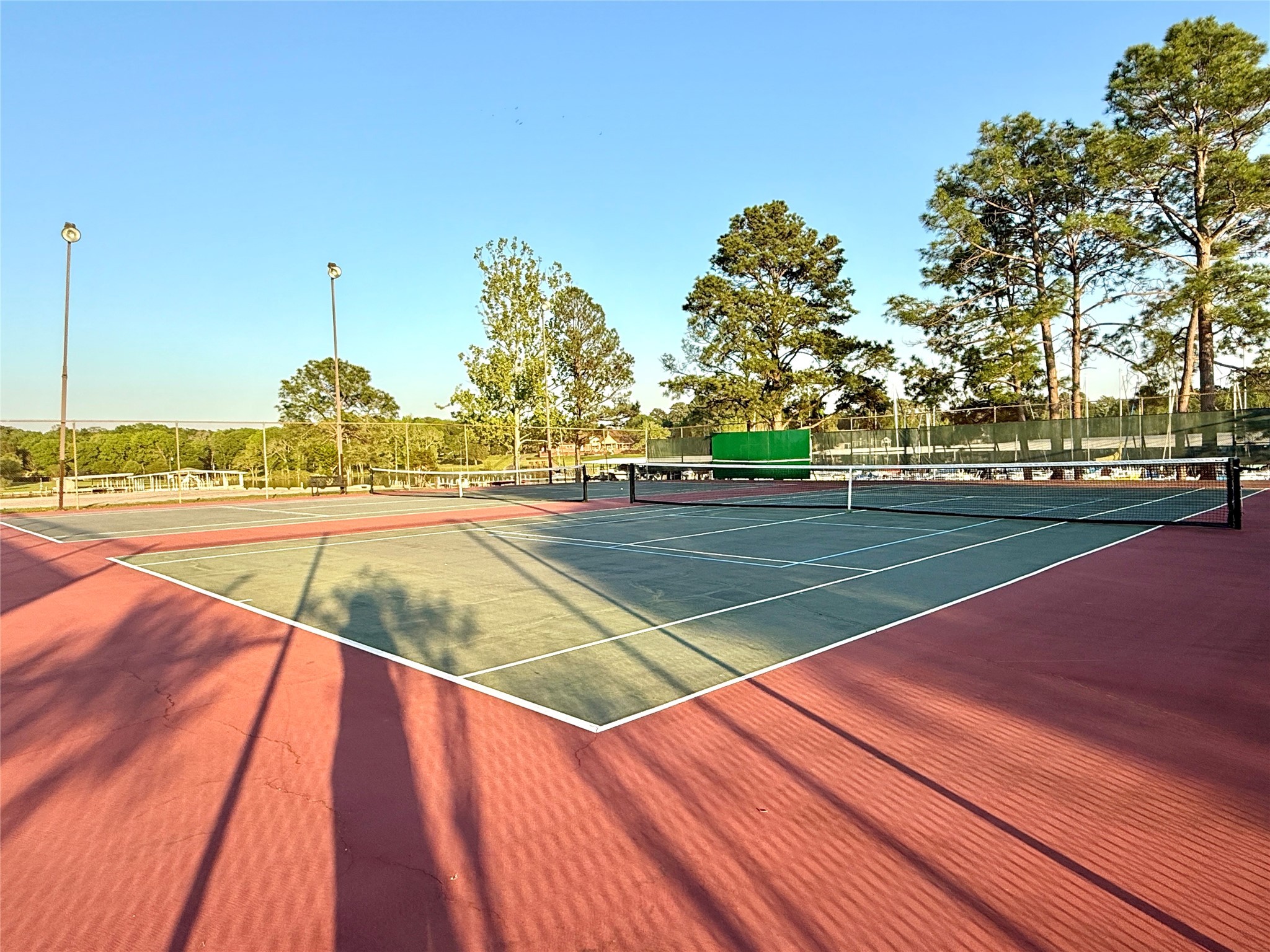 7041 Kingston Cove Lane, Unit 241 Willis, TX 77318 - Photo 14 of 17 a view of a tennis court