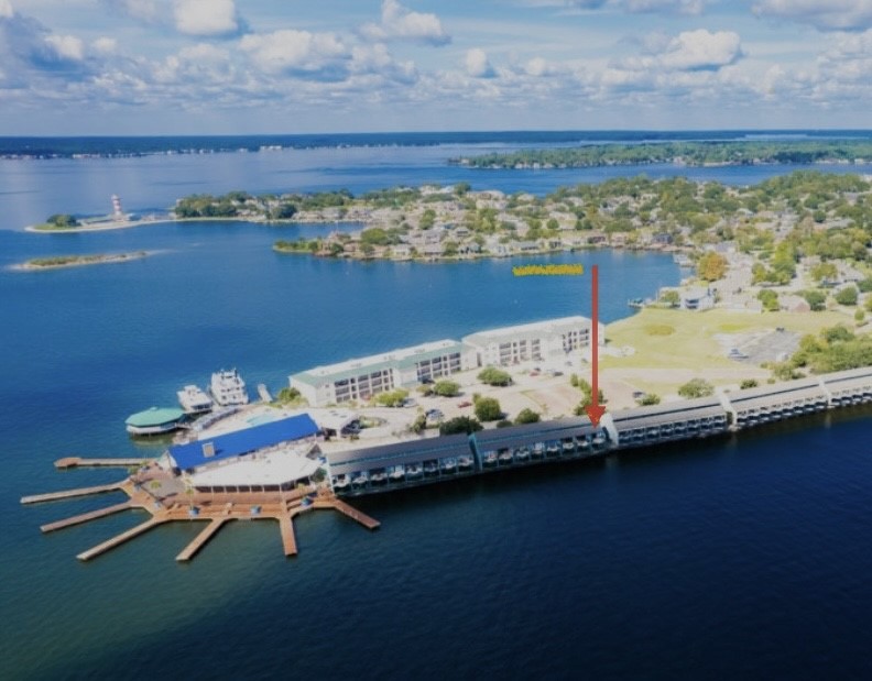 7041 Kingston Cove Lane, Unit 241 Willis, TX 77318 - Photo 17 of 17 a wooden floor with table and chairs