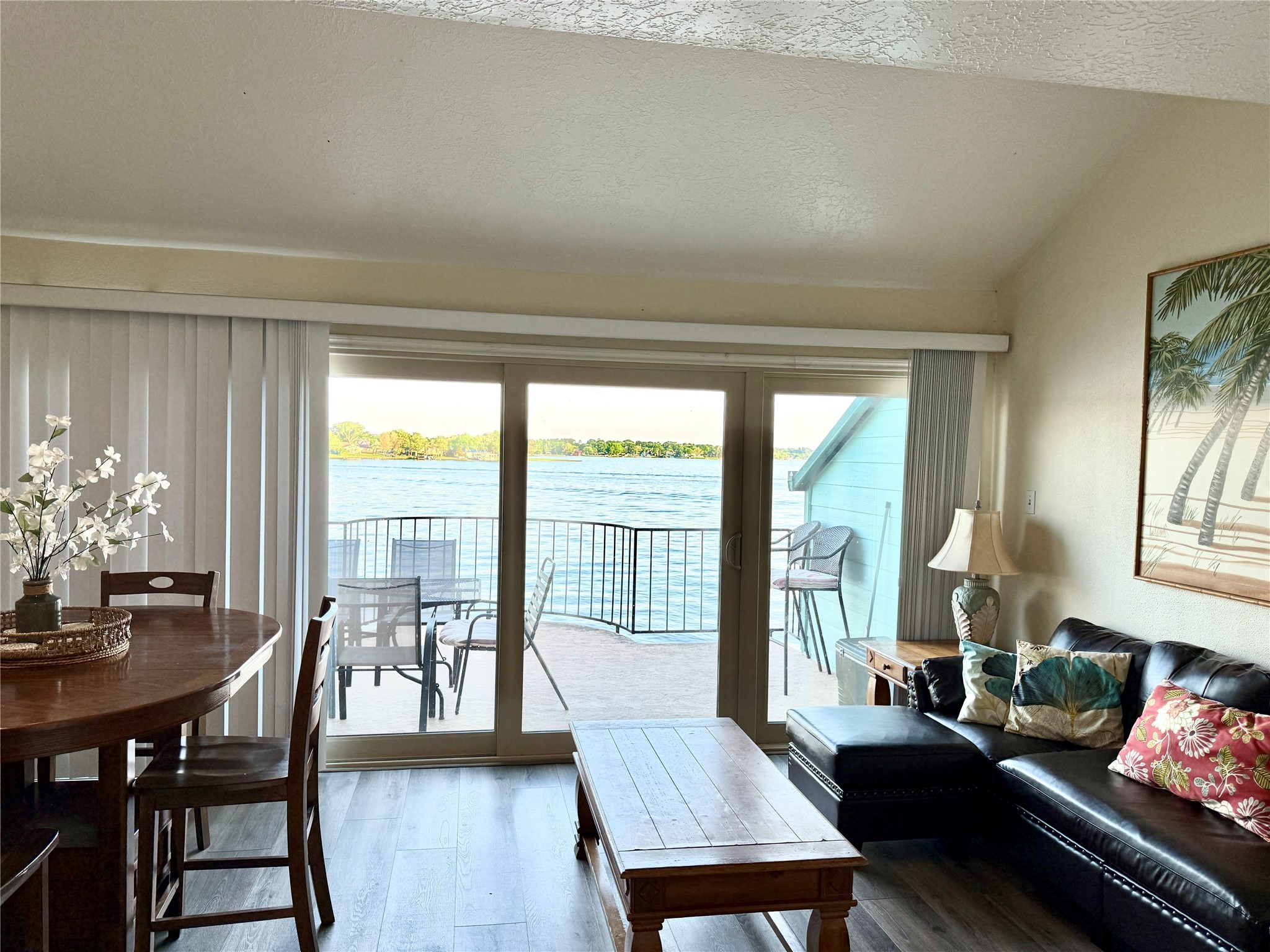 7041 Kingston Cove Lane, Unit 241 Willis, TX 77318 - Photo 7 of 17 a living room with furniture and a large window