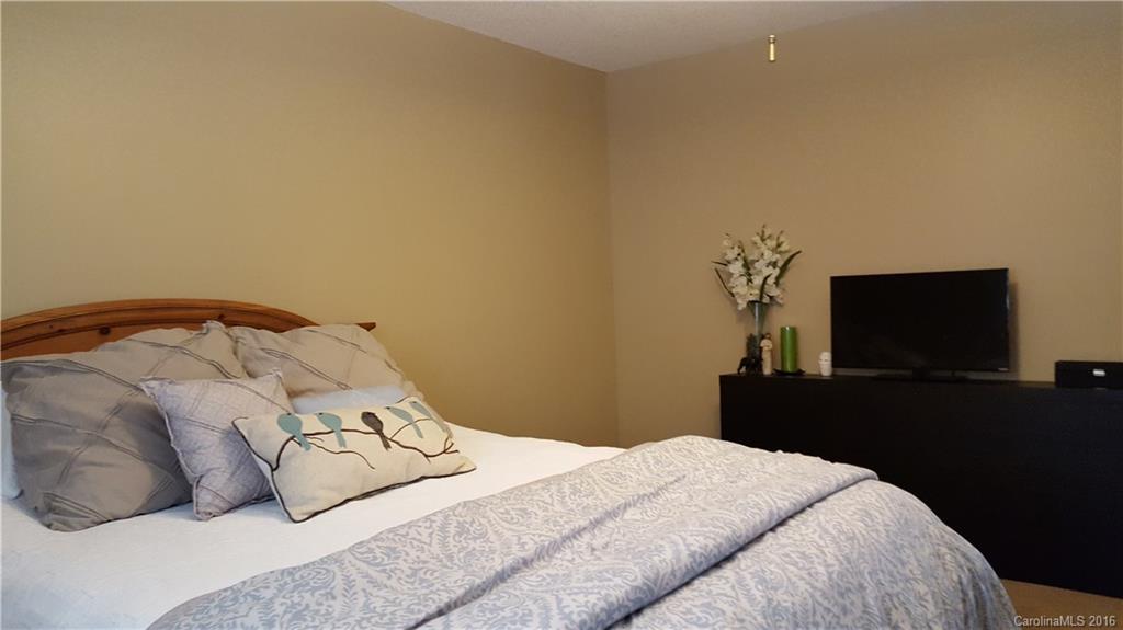 1130 Foxberry Road Lincolnton, NC 28092 - Photo 11 of 22 a bedroom with a bed and a flat screen tv