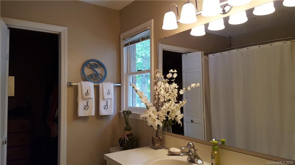 1130 Foxberry Road Lincolnton, NC 28092 - Photo 12 of 22 a bathroom with a sink mirror and vanity