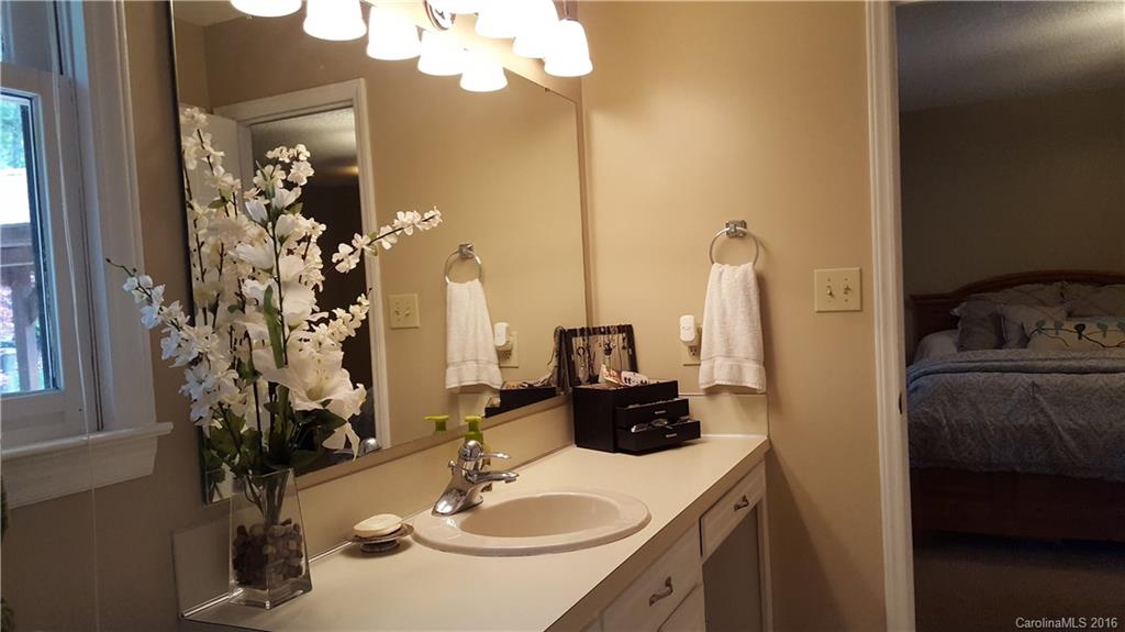 1130 Foxberry Road Lincolnton, NC 28092 - Photo 13 of 22 a bathroom with a sink vanity and a mirror