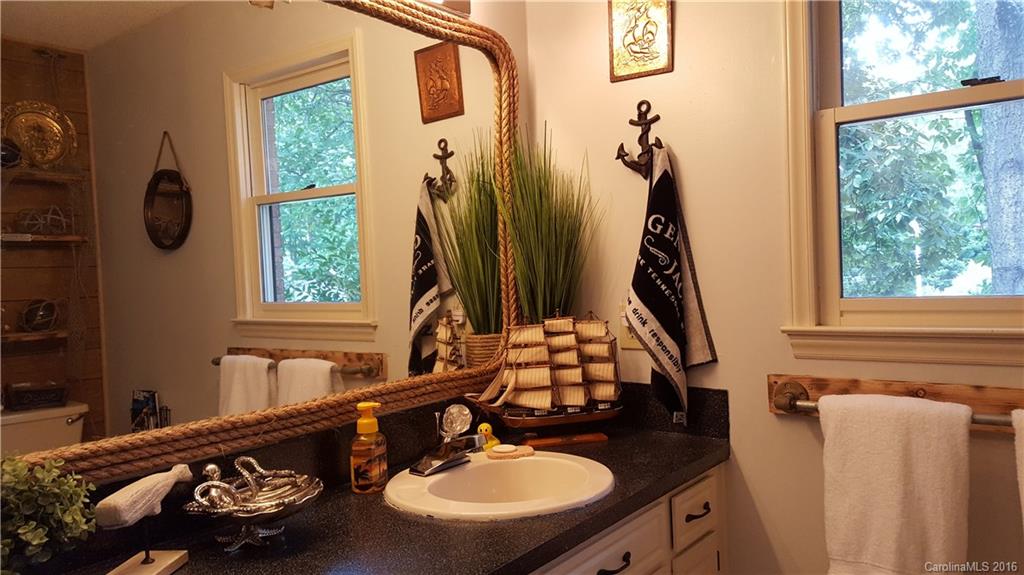 1130 Foxberry Road Lincolnton, NC 28092 - Photo 16 of 22 a bathroom with a sink mirror and a window