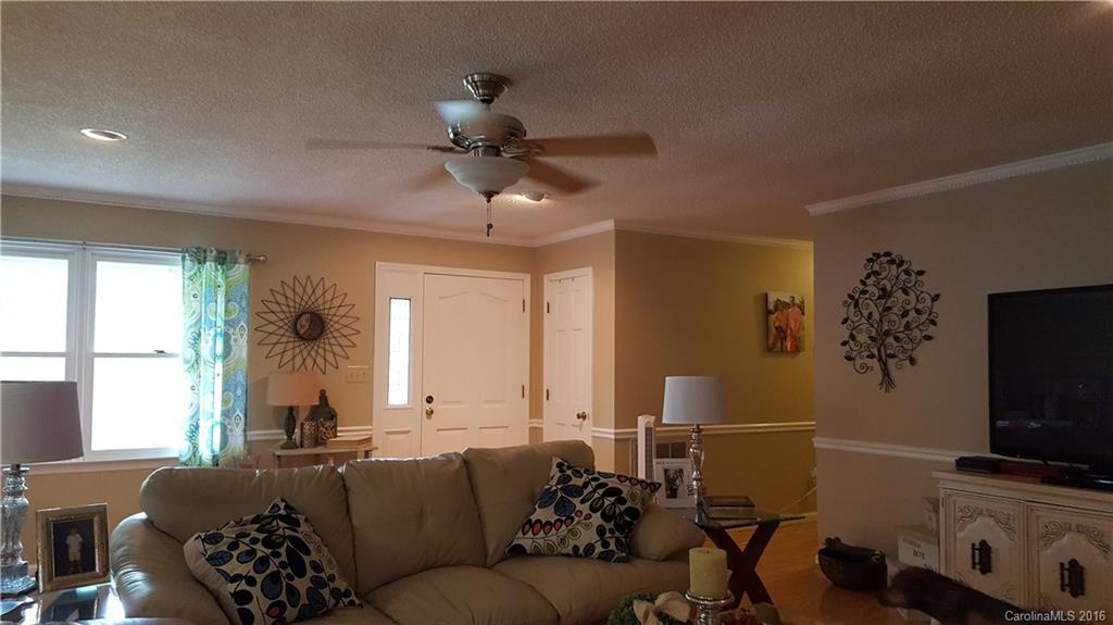 1130 Foxberry Road Lincolnton, NC 28092 - Photo 6 of 22 a living room with furniture and a flat screen tv