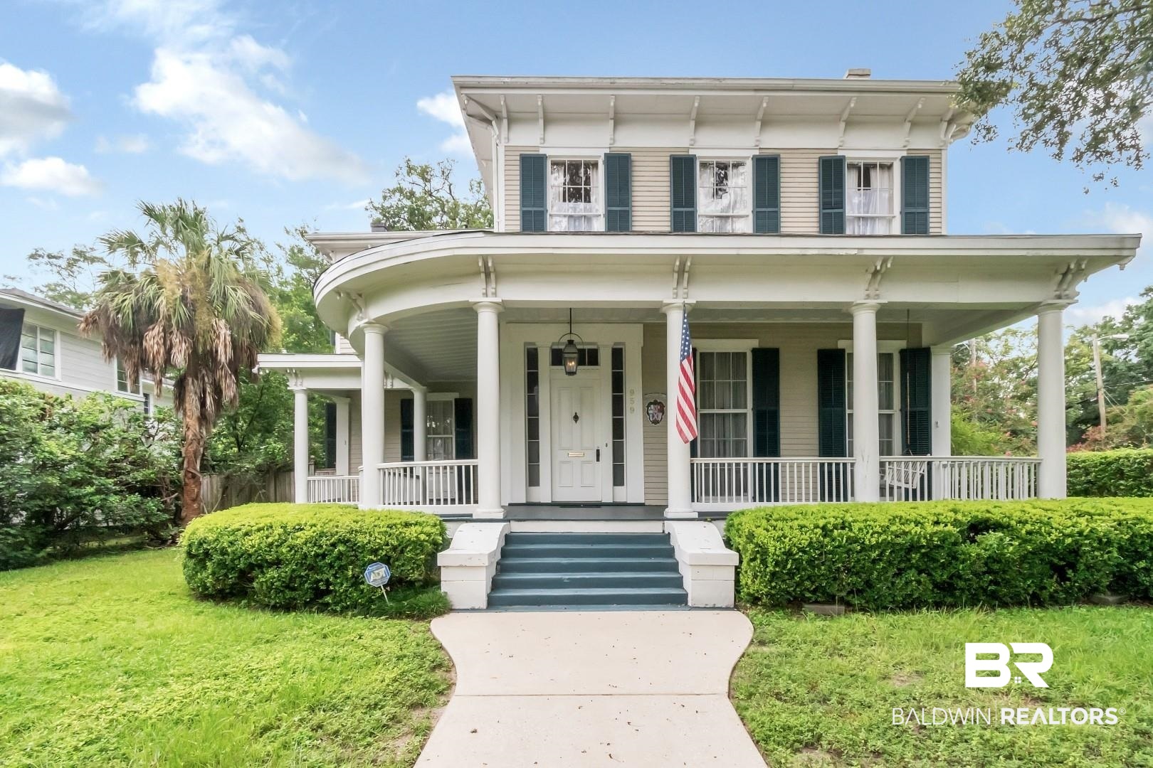 959 Dauphin Street Mobile, AL 36604 - Photo 35 of 43 Italianate-style house featuring a porch and a front lawn