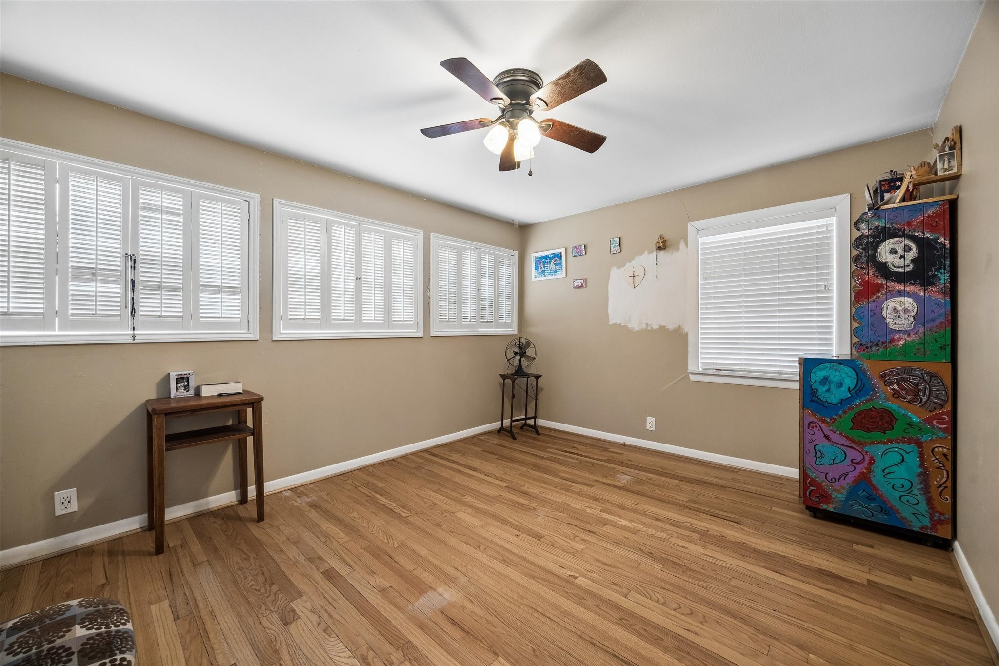 6821 Leader Street Houston, TX 77074 - Photo 10 of 14 a view of an empty room with window and wooden floor
