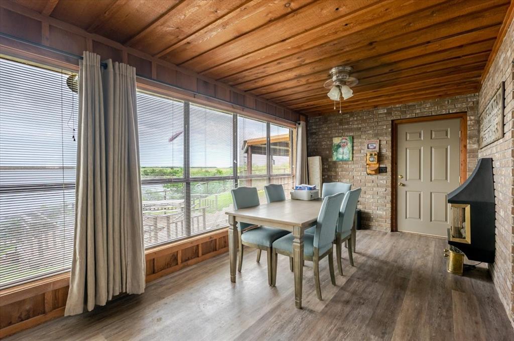199 Willingham Loop Seymour, TX 76380 - Photo 12 of 40 a view of a dining room with furniture window and wooden floor