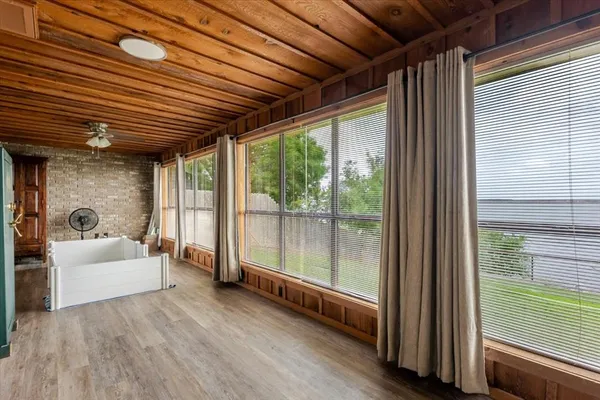 a view of living room kitchen with furniture and floor to ceiling window