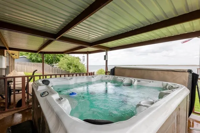 a view of a patio with table and chairs