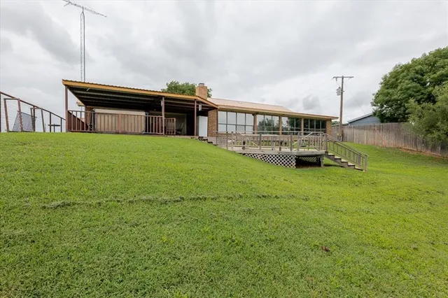 an aerial view of a houses with outdoor space