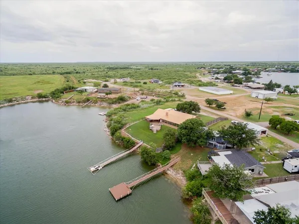 an aerial view of a houses with outdoor space