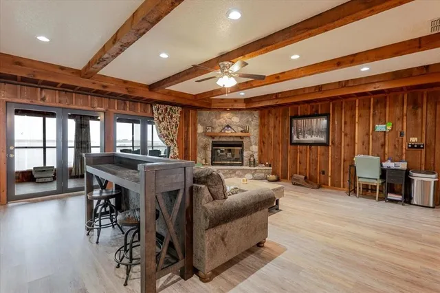 a living room with furniture and wooden floors