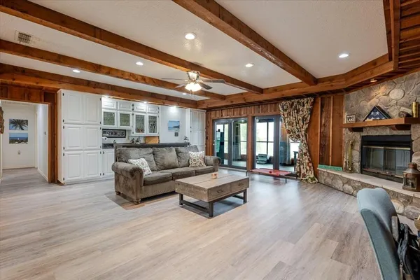 a living room with furniture gym equipment and a fireplace