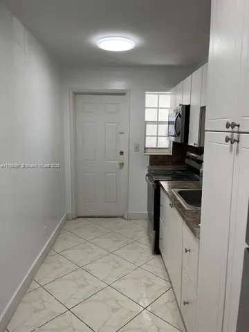 a view of an empty room with a balcony