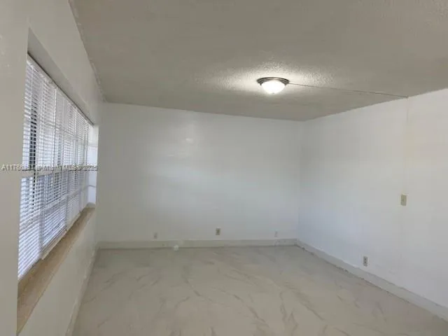 a view of a room that has a window in it