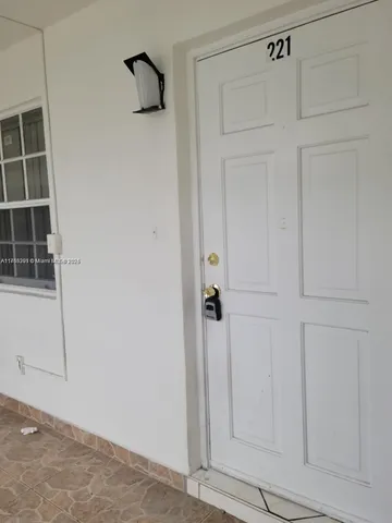 a kitchen with stainless steel appliances granite countertop a refrigerator and a stove