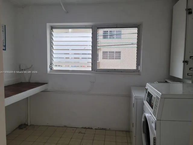 a view of empty room with windows