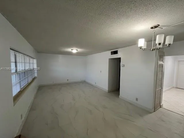 a kitchen with a sink and a stove top oven