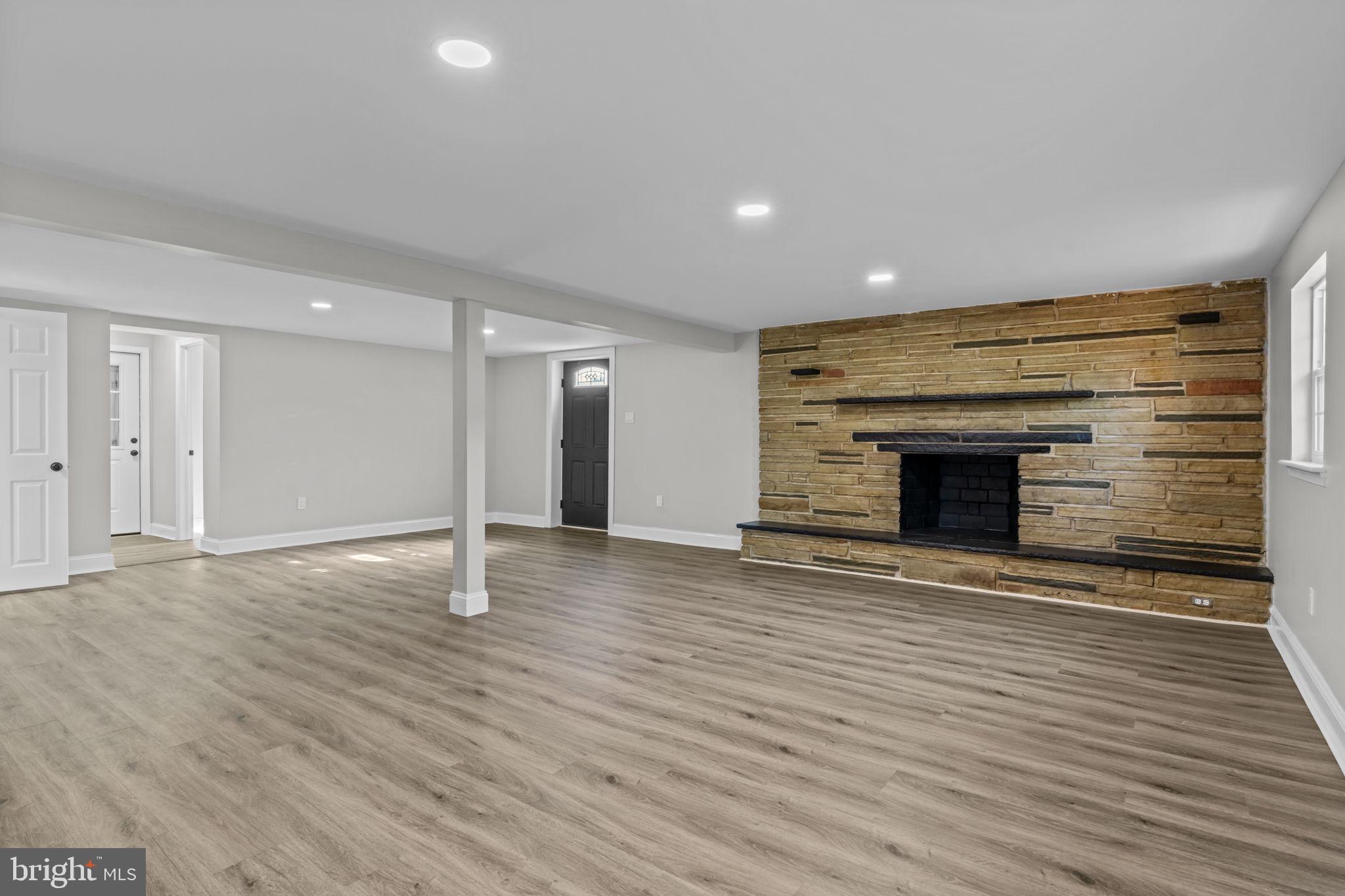 249 New Road Churchville, PA 18966 - Photo 13 of 35 Lower level family room with fireplace