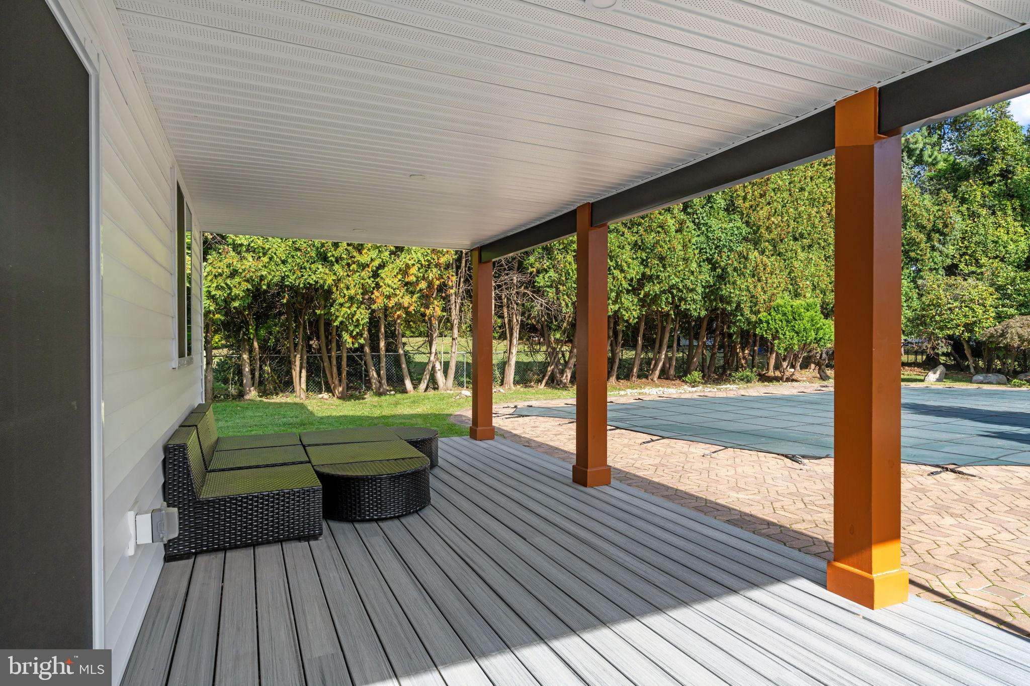 249 New Road Churchville, PA 18966 - Photo 2 of 35 Trex deck overlooks the pool and backyard