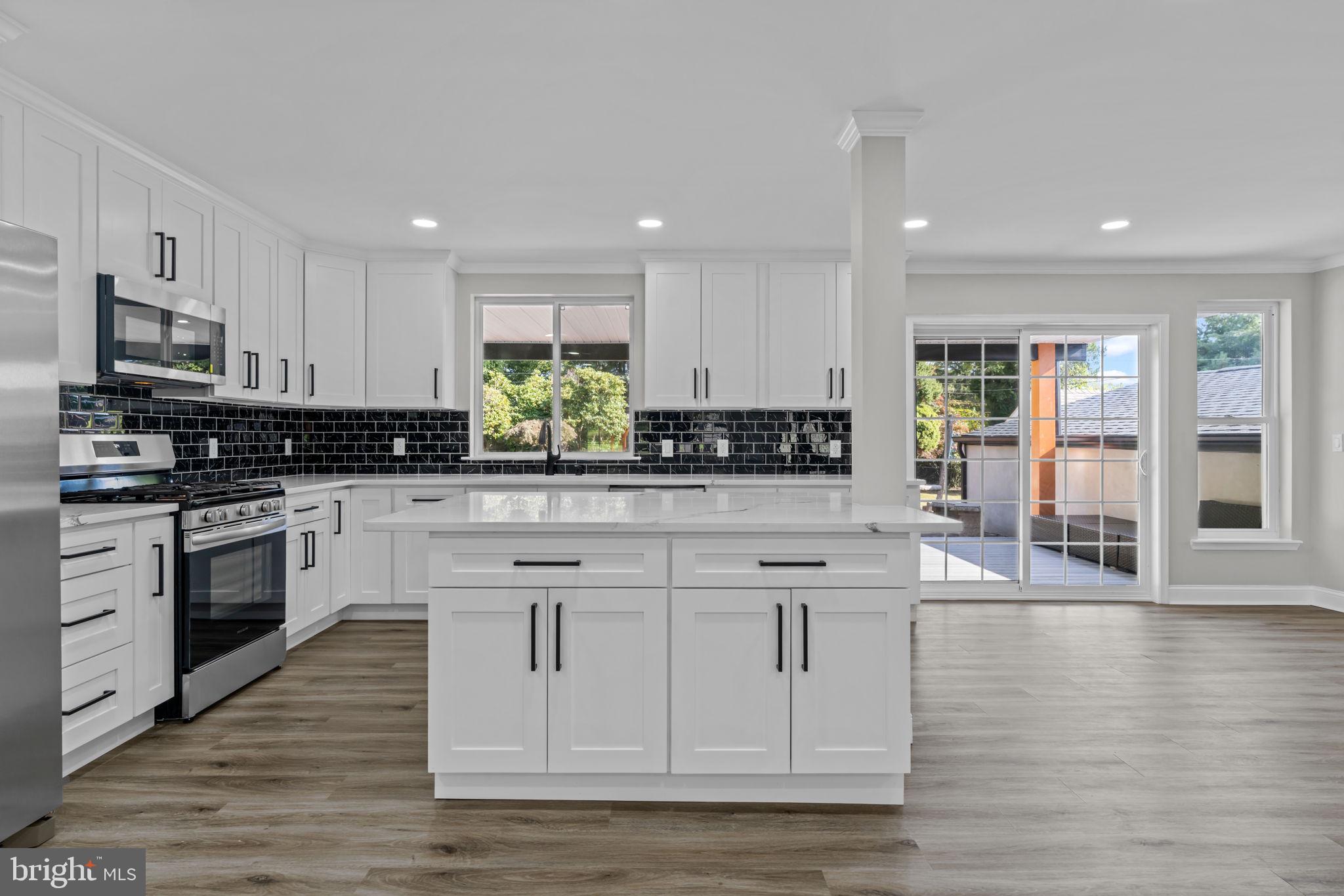 249 New Road Churchville, PA 18966 - Photo 10 of 35 Kitchen with quartz countertops & tiled backsplash