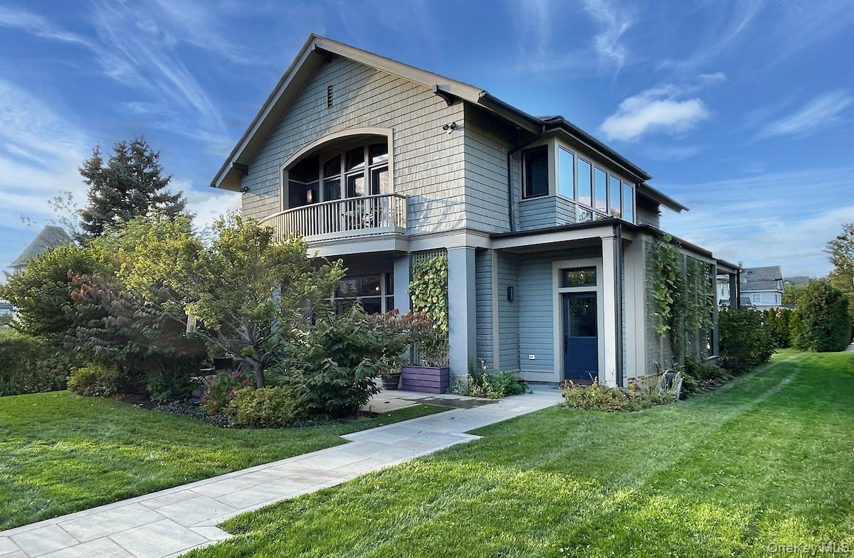a front view of a house with a yard and porch