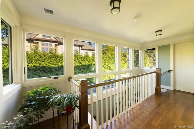 a bedroom with a large bed and a large window
