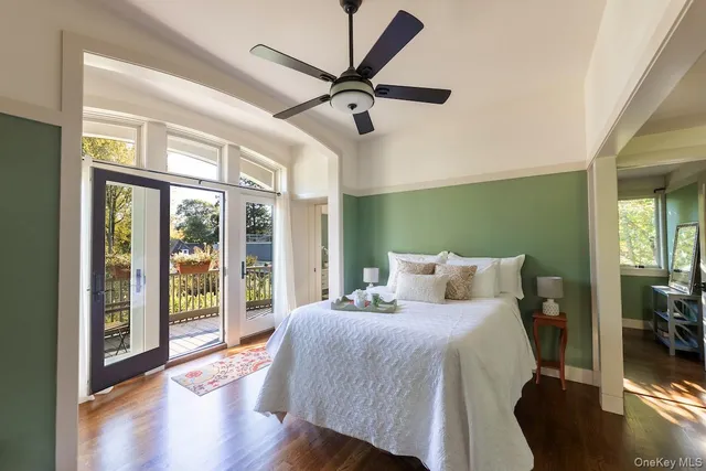 a bed sitting in a bedroom next to a window