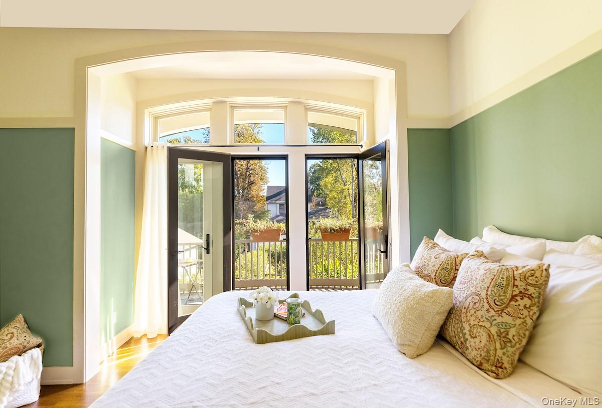 10 Sherman Avenue Dobbs Ferry, NY 10522 - Photo 18 of 36 a bed sitting in a bedroom next to a window