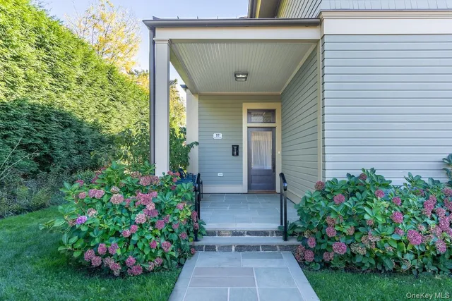 a view of a house with a backyard and garden